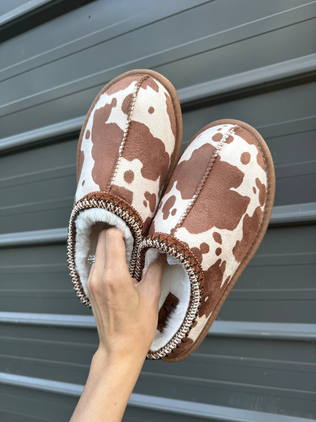 Cow print bruin slippers